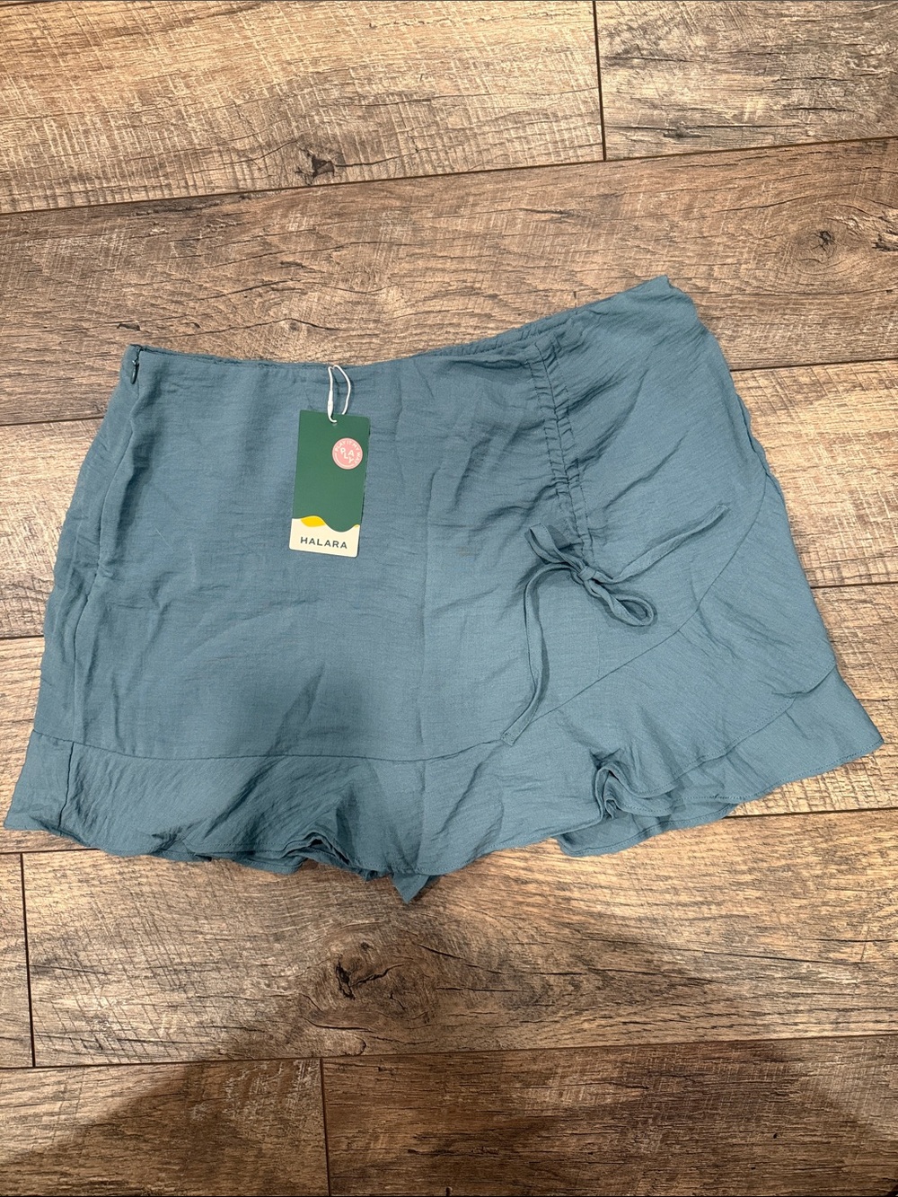 HALARA Teal Women's Ruffle Hem Skirt with built-in shorts.